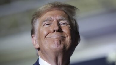 2384036 donald trump rare smile court pecker e1777267902777