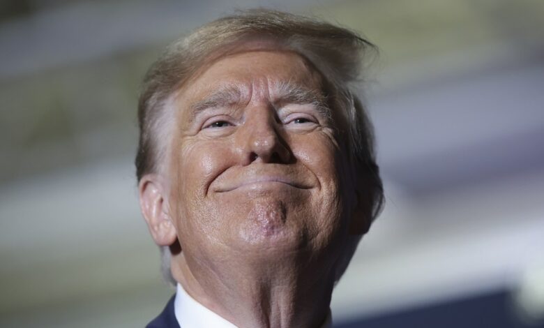 2384036 donald trump rare smile court pecker e1777267902777