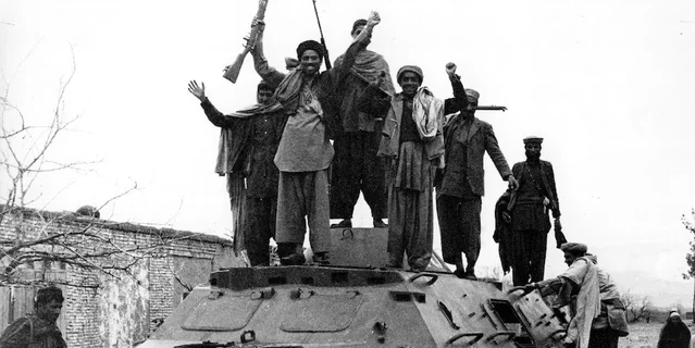 jubilant afghan guerrillas on a captured russian armoured v0 pyaz67a1n40c1 e1777275569901