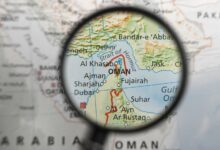map of strait of hormuz and surrounding area under magnifying glass illustration