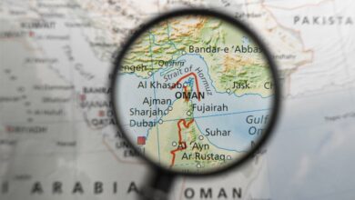 map of strait of hormuz and surrounding area under magnifying glass illustration
