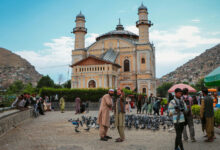 Tourists taking a selfie in front of the Shah Do Shamshira Mosque in Kabul Afghanistan
