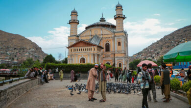 Tourists taking a selfie in front of the Shah Do Shamshira Mosque in Kabul Afghanistan