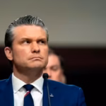 protester disrupts senate hearing calls war secretary pete hegseth a war criminal e1777708745265